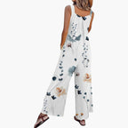 Model wearing floral jumpsuit, standing pose showing full length silhouette