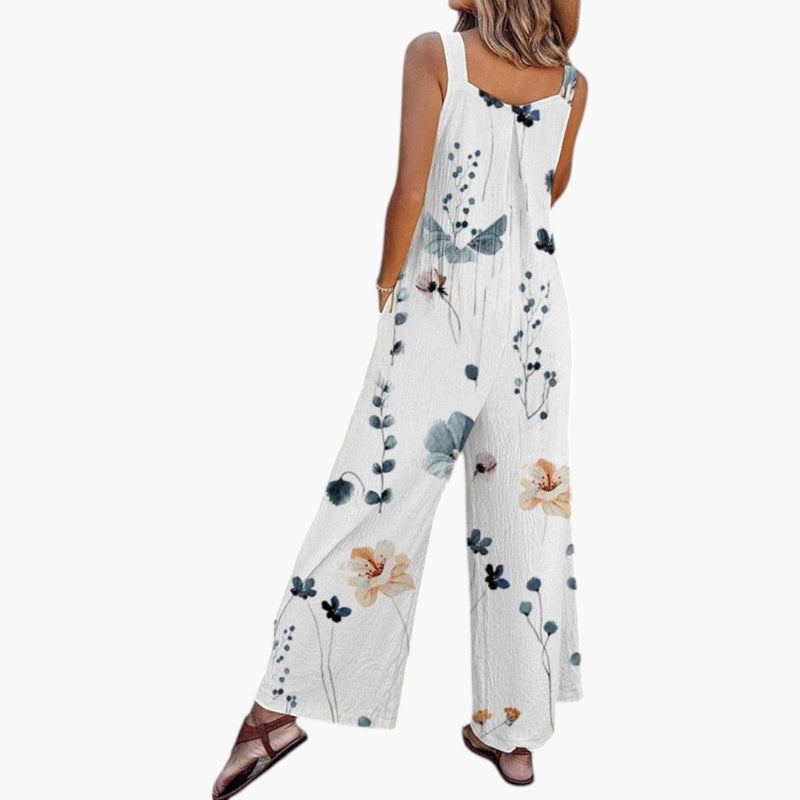 Model wearing floral jumpsuit, standing pose showing full length silhouette