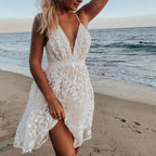 White lace mini dress with deep V-neckline displayed on flat background