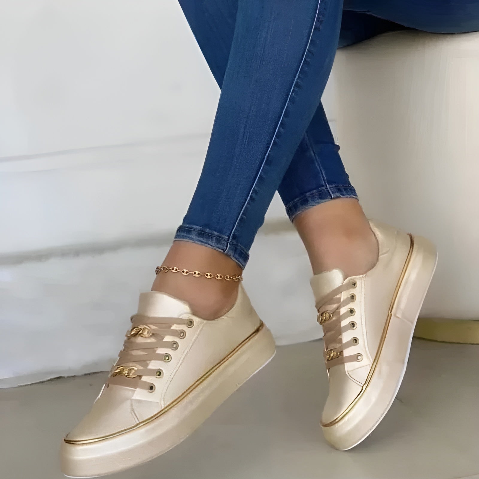 Model wearing trainers, walking pose from front angle