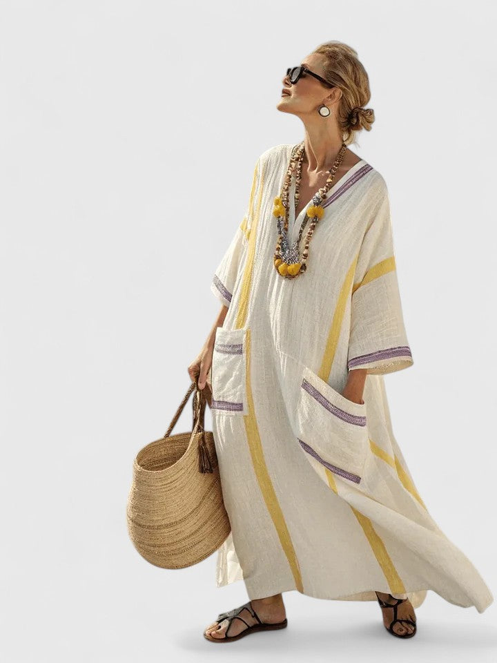 Model walking in striped maxi dress showing natural movement