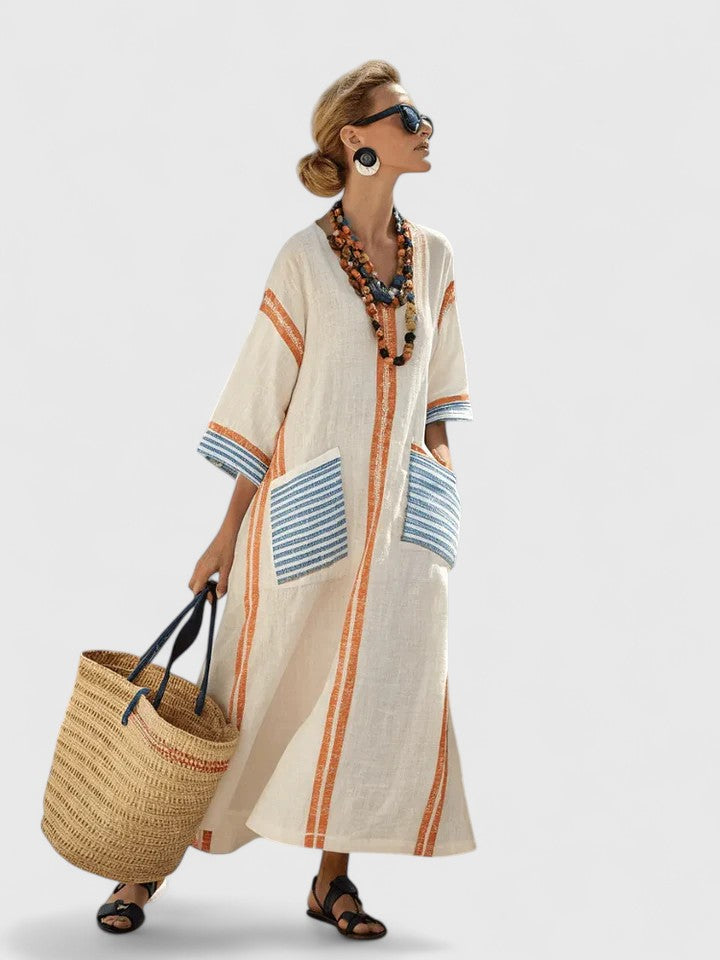 Model wearing striped maxi dress showing patch pocket detail