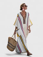 Model from side angle showing dress drape and relaxed fit