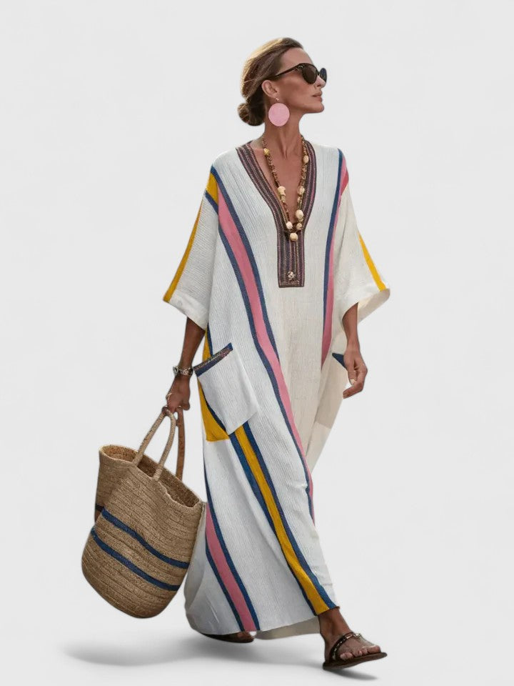Model from side angle showing dress drape and relaxed fit