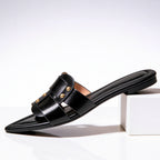 Overhead view of mules showing pointed toe silhouette and strap placement