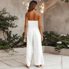 Model posing in strapless jumpsuit, full length shot showing silhouette