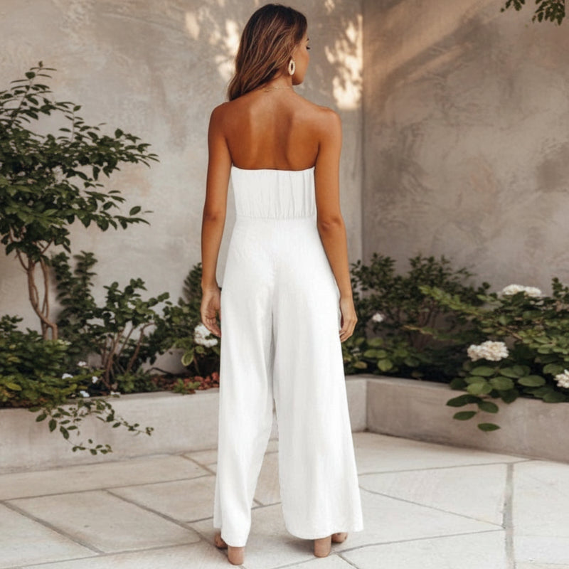 Model posing in strapless jumpsuit, full length shot showing silhouette