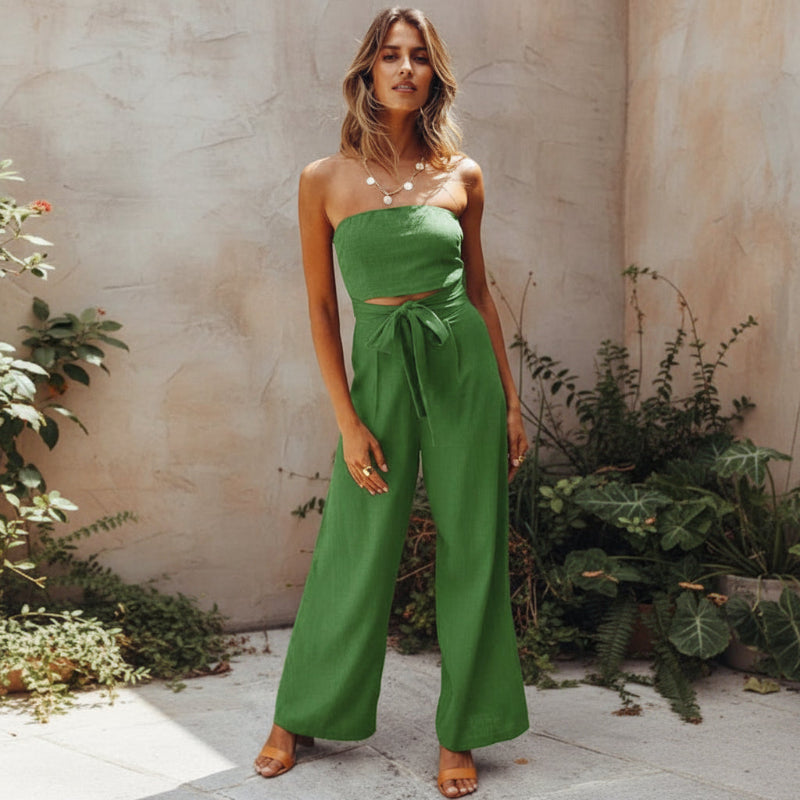 Back view of strapless jumpsuit showing wide leg drape