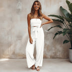Strapless wide leg jumpsuit with tie waist, front view on model