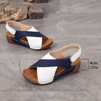 Woman walking beach in two-tone wedge sandals