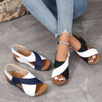Woman wearing two-tone wedge sandals, relaxed pose