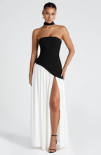 Full outfit shot of woman in strapless maxi dress, formal pose