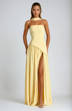 Woman wearing strapless high slit maxi dress, full-length front view