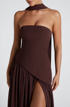 Three-quarter angle of strapless dress with flowing skirt