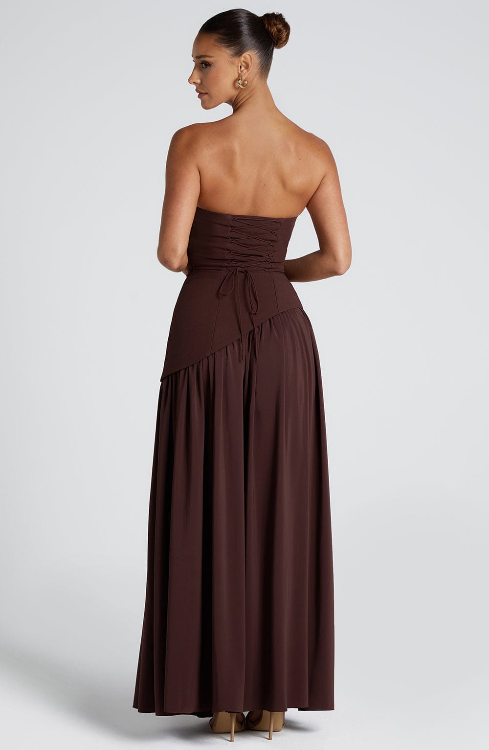 Back view showing elegant asymmetric overlay design